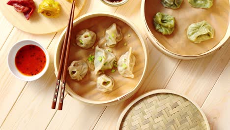 traditional chinese dumplings served in the wooden bamboo steamer