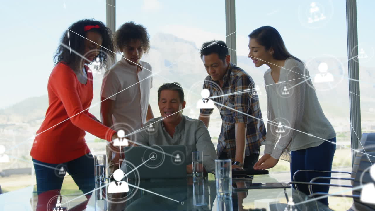 Animation of network of profile icons against team of diverse colleagues discussing at office