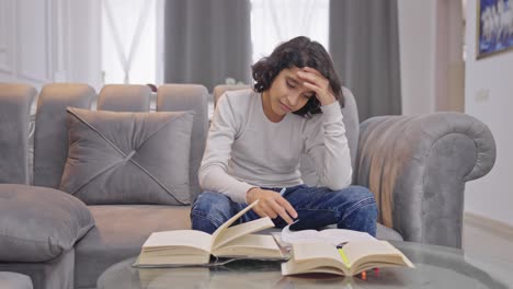 stressed and tensed indian kid boy studying