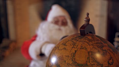 santa claus with globe.