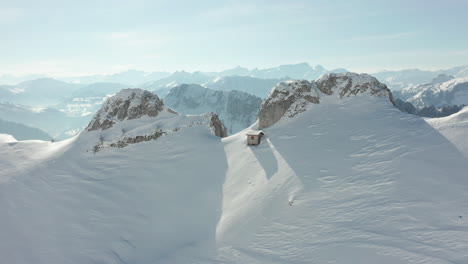 flying of snow covered cliff and revealing beautiful valley