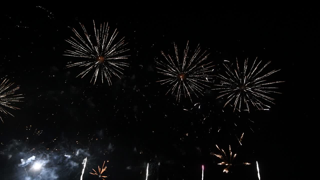 4K long time seamless loop of real colourful fireworks festival in sky display at night during national holiday, new year party 2022