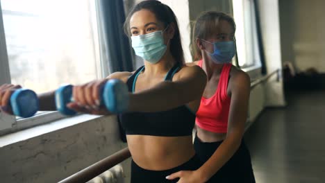 women working out with masks on