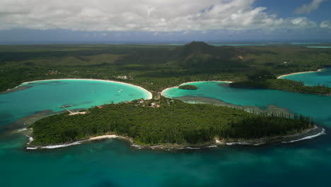 high altitude aerial parallax view of kuto bay, presqu’île de kuto, and kanumera bay