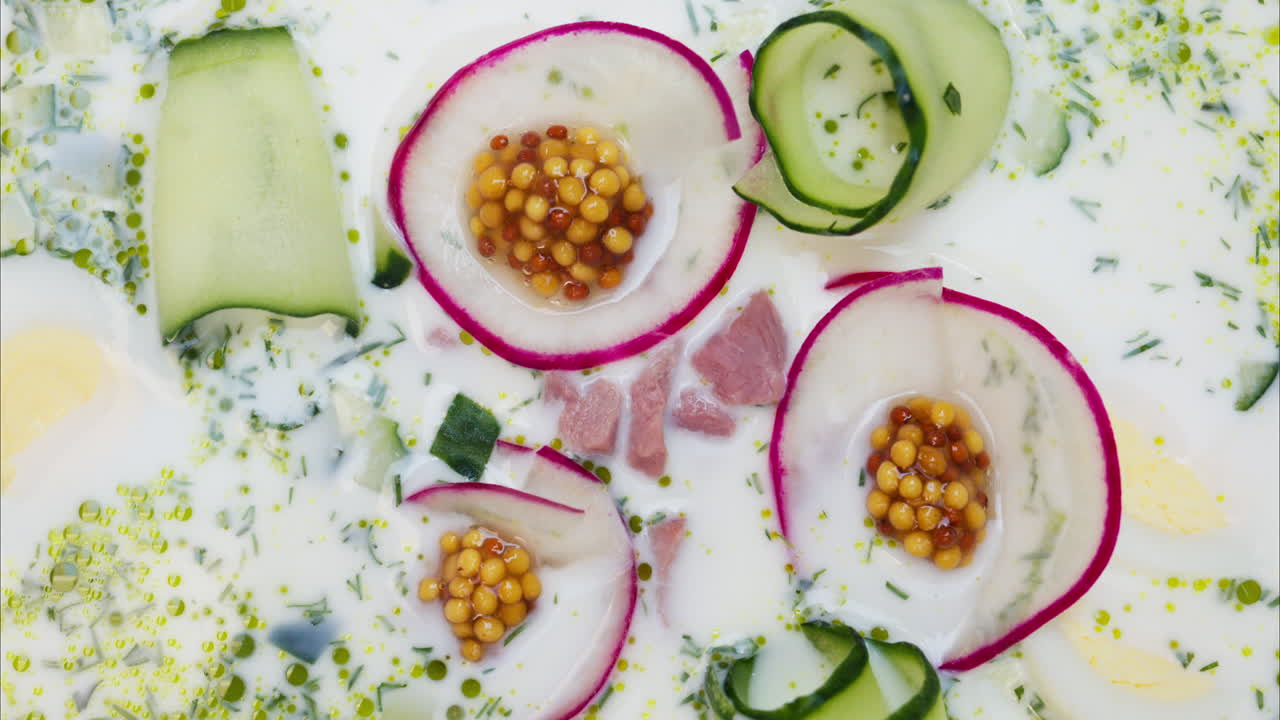 Close up of an Okroshka soup in a white plate