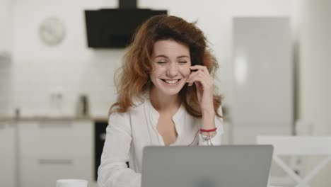 Business-woman-working-computer-at-home.-Happy-young-lady-sitting-with-laptop