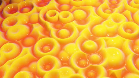 looped festive liquid bg in 4k. abstract wavy pattern on bright glossy surface, liquid gradient yellow red, waves on paint fluid in smooth animation. glitters on viscous 3d liquid. creative backdro