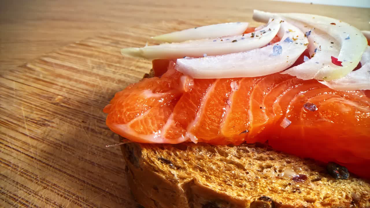 Close-up shot of salmon and onion on toast