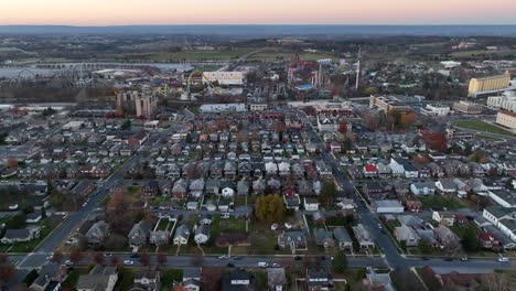 Wide-aerial-of-Hershey,-Pennsylvania-during-autumn-sunset