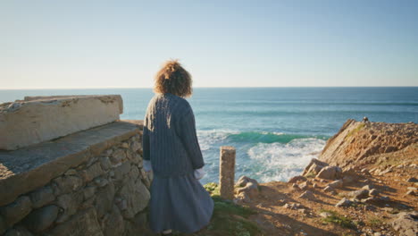 casual woman going ocean mountain. serene girl looking camera enjoying weekend