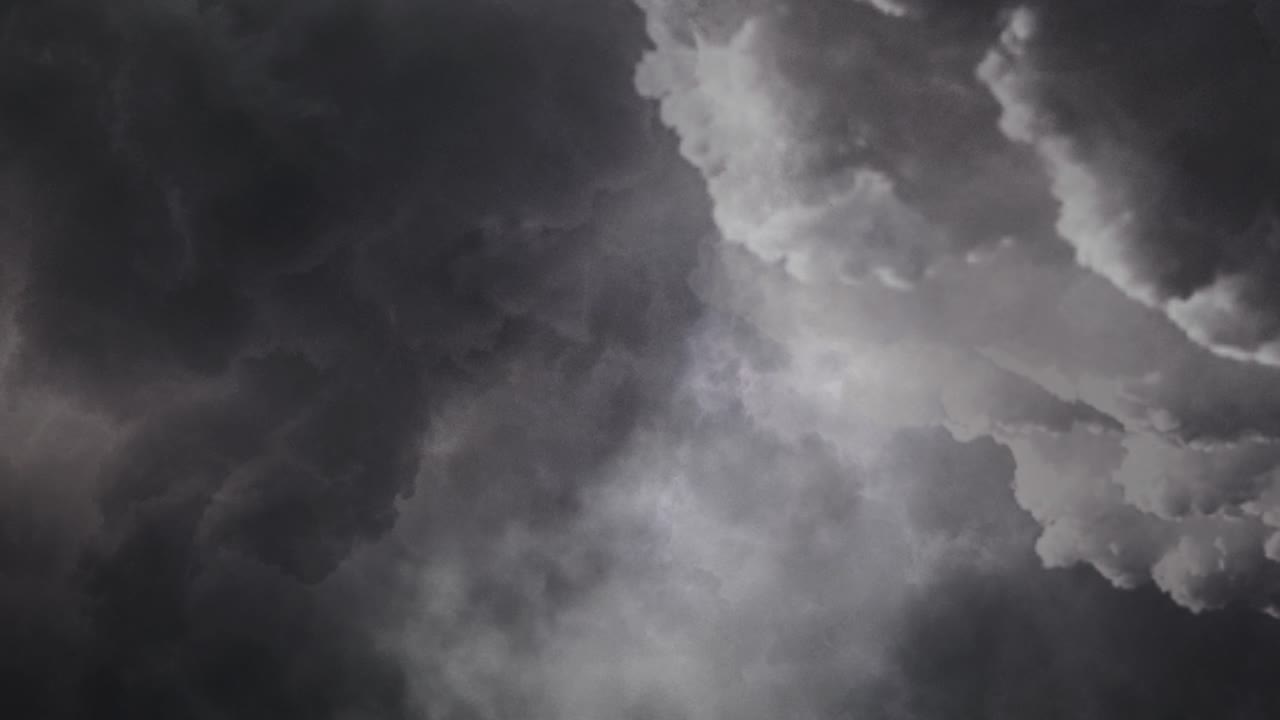 4k thick clouds in the sky with lightning flashes