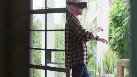 Albino-african-american-man-with-dreadlocks-using-vr-headset