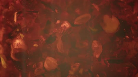 macro shot of chili oil moving in a glass bottle