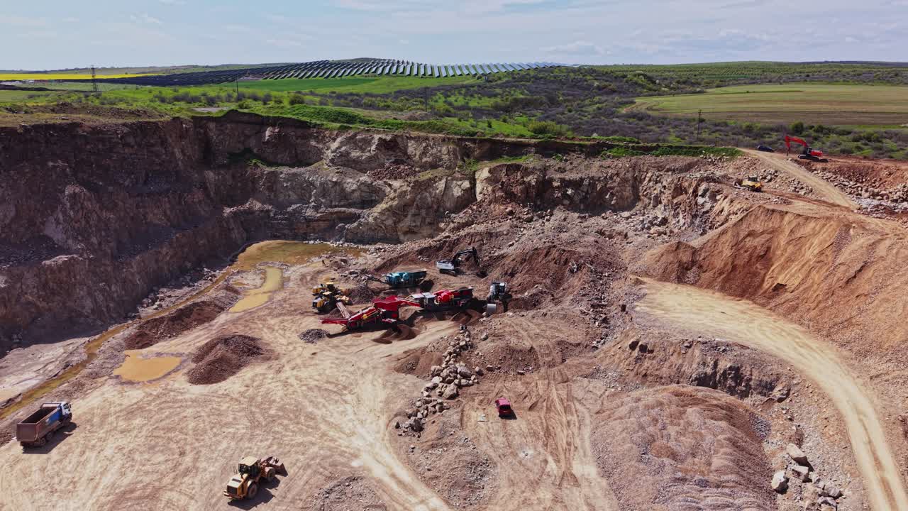 Construction site with machines working in a rocky area