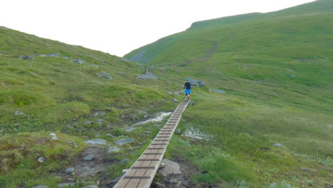 local norwegian hiker on its way to the worlds famous hike ryten in lofoten