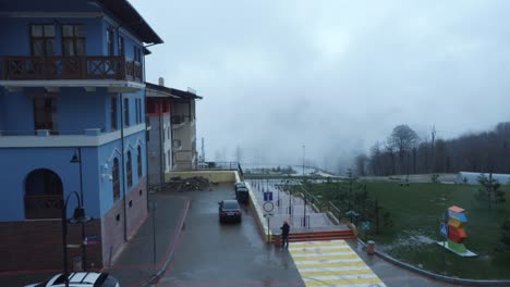 snowy mountain town with foggy viewpoint