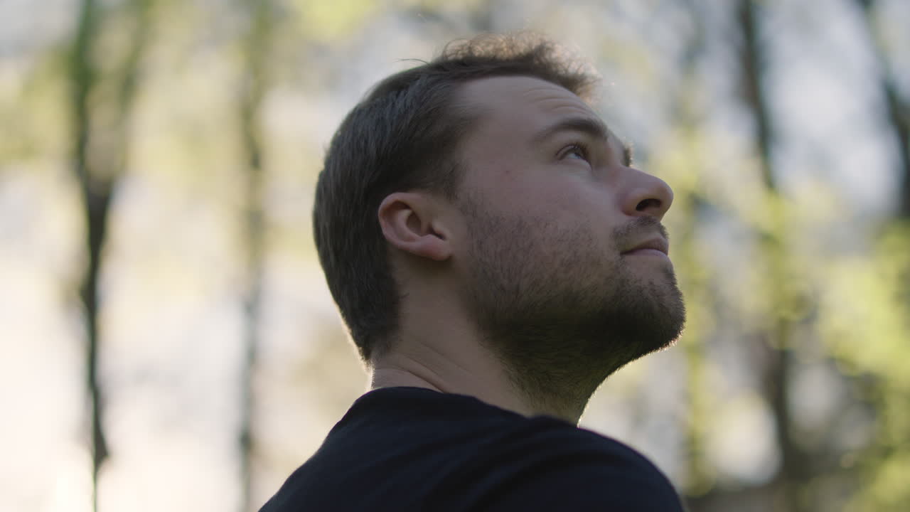 Portrait of a man looking up outdoors