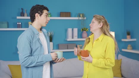 Mother-and-son-having-a-pleasant-conversation-at-home.