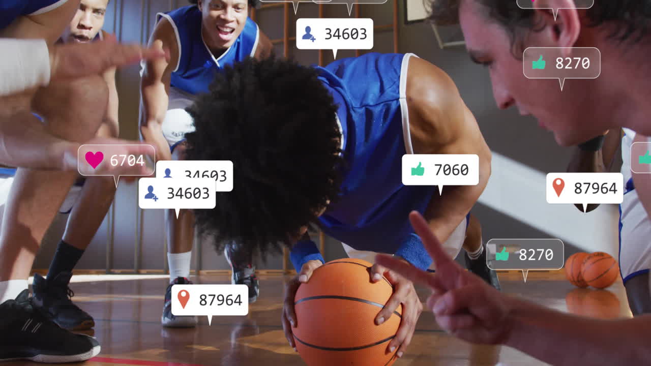 Group of six men performing basketball fitness training in gym, with floating social media icons