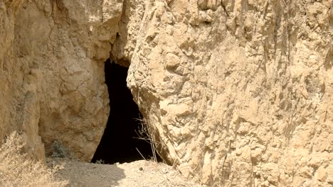 close up of a cave entrance at qumran, israel