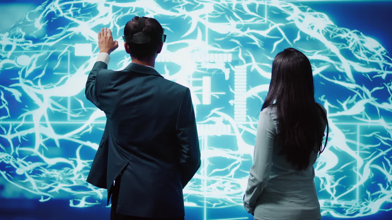 Engineering team wearing VR headset looking at hologram of AI