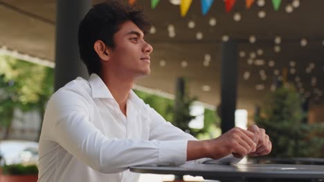 young handsome male waiting service at restaurant table