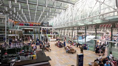 crowds and activities at paddington station, london