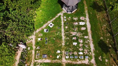 little pet cemetery with a gazebo. a green forest is nearby. drone footage. bratislava, slovakia.