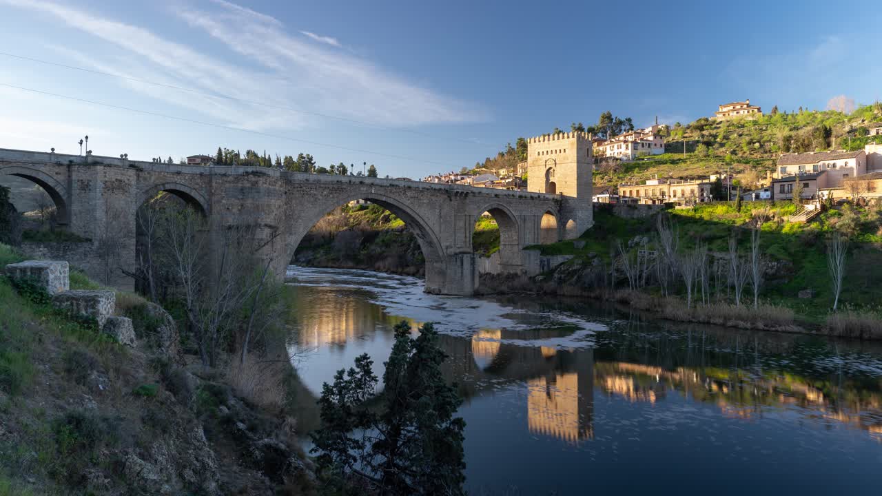 Old Bridge over the River in a Spanish Town