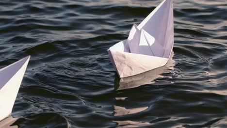 paper boats on water