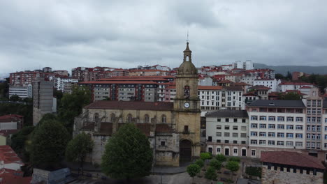 aerial view of a spanish town with a church and clock tower