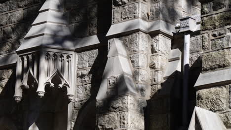 sunlight and shadow pass over a gothic church