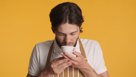 caucasian man in front of camera on yellow background.