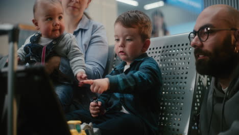 family waiting at the airport