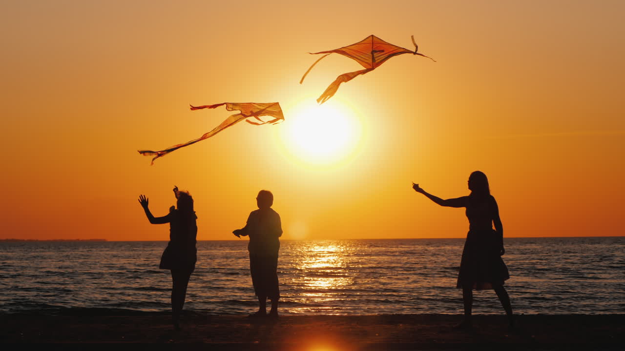 한 젊은 가족이 적극적으로 함께 시간을 보냅니다 - 그들은 연을 연주합니다