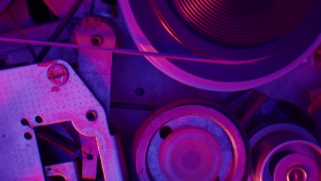 vintage machine mechanism under neon lighting