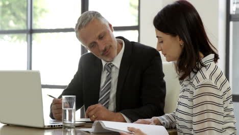 Business-people-speaking-during-a-meeting-