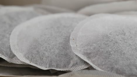 tea bags and yellow  mug on table