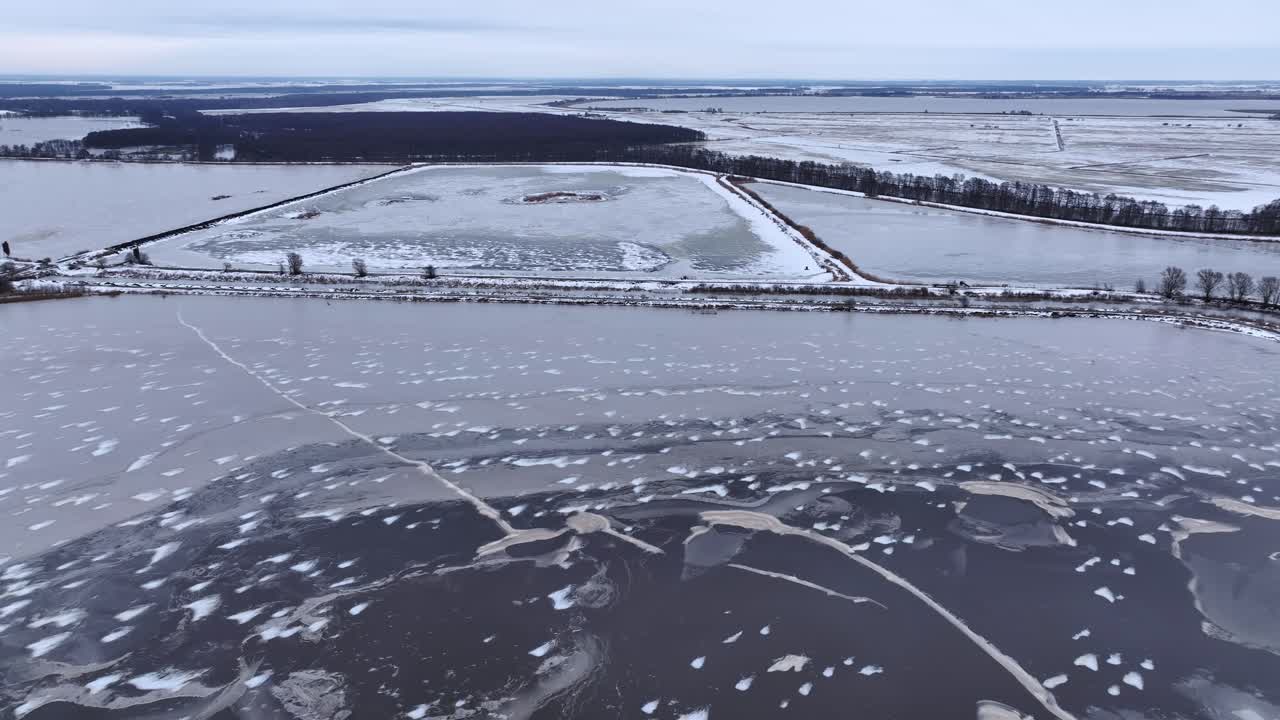 Panoramic view from above, large areas of meadows flooded with water during winter. Europe Lithuania.