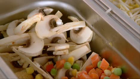 Industrial food prep: Vibrant chopped vegetable mix, mushrooms
