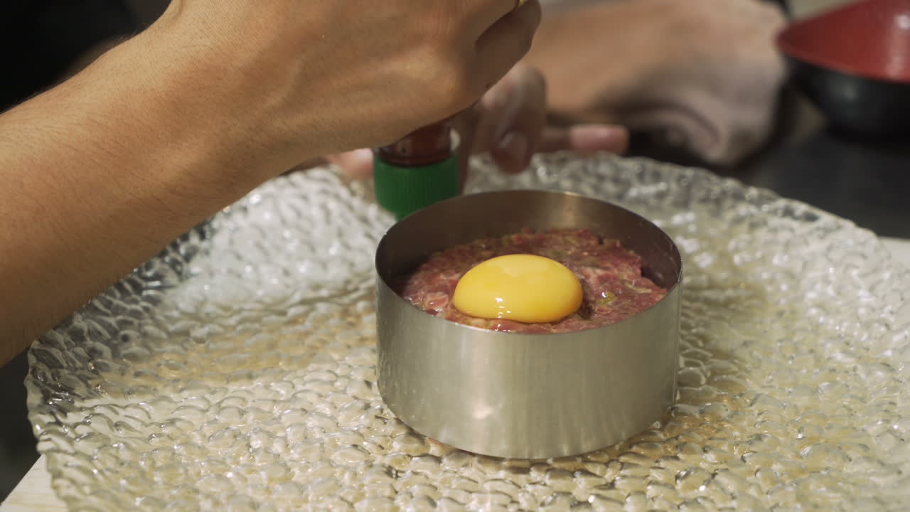 Preparing Steak Tartare with Egg Yolk