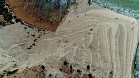 people exploring the unique cliff in italy called the stair of the turks