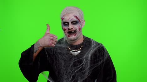 Sinister-man-Halloween-zombie-raises-thumbs-up-agrees-with-something-or-gives-positive-reply,-likes