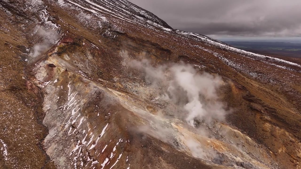 Stunning 4K 30fps drone footage of the Ketetahi Hot Springs located on the Tongariro Alpine Crossing. This aerial view captures the steaming geothermal vents and rugged volcanic landscape