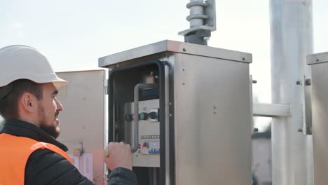 setting up equipment at a transformer substation. construction of a transformer substation