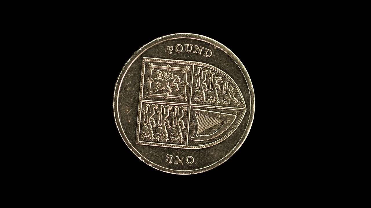 United Kingdom 2015 one pound coin reverse with quartered royal shield of arms rotating on black background