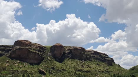 Moluti-sandstone-cliffs-at-the-border-of-Lesotho-in-South-Africa-at-the-Camelroc-travel-guest-farm,-stunning-cloud-time-lapse,-most-amazing-mountains-and-green-scenery-landscapes