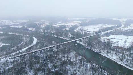 aerial shot of the snow covered chattahoochee river and national park in atlanta, georgia on january 10th 2025.