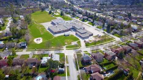 aerial flight over a school in a residential neighborhood