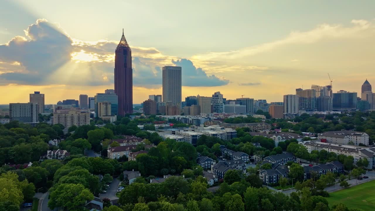 Atlanta city skylines and greenery at sunset, Revealing drone shot